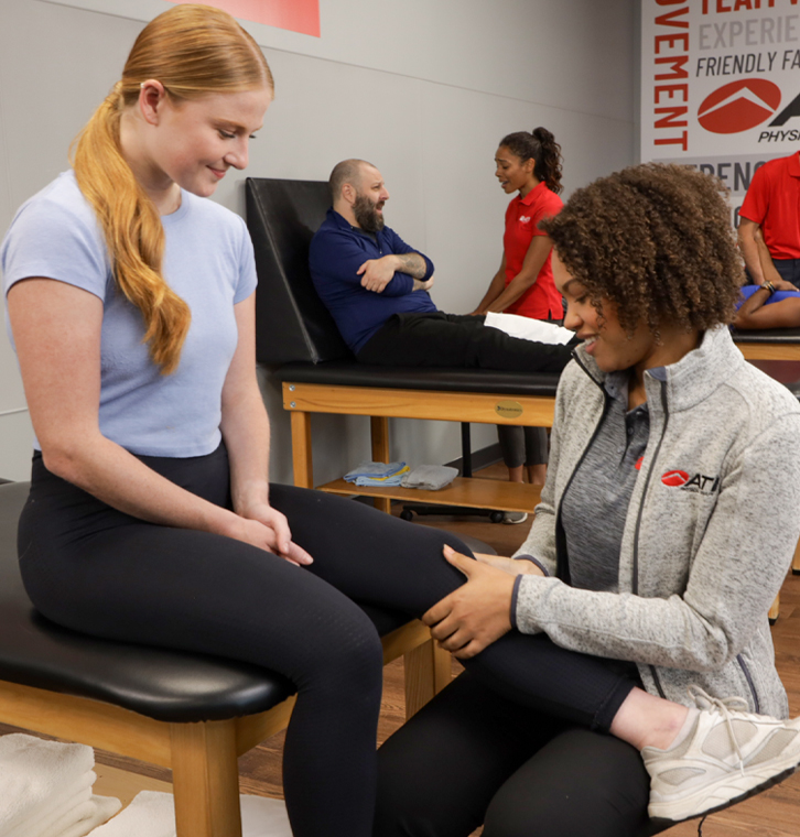 Manual therapy session in progress.