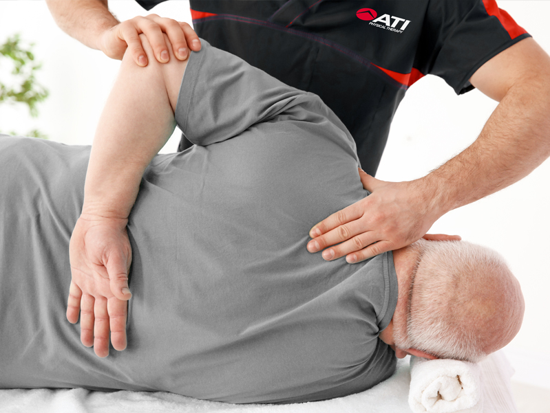 Manual therapy session in progress.