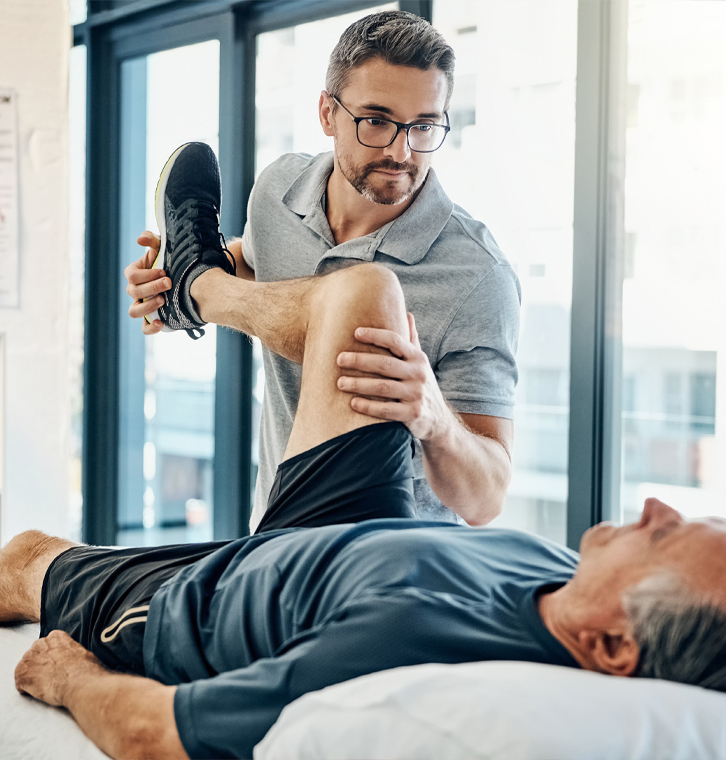 Men's pelvic health physical therapy session in progress.