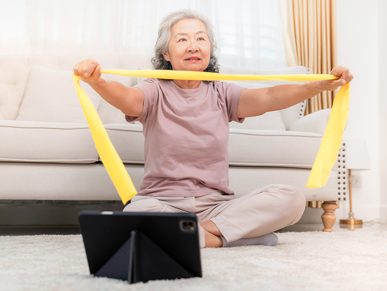 Woman engaging in online physical therapy